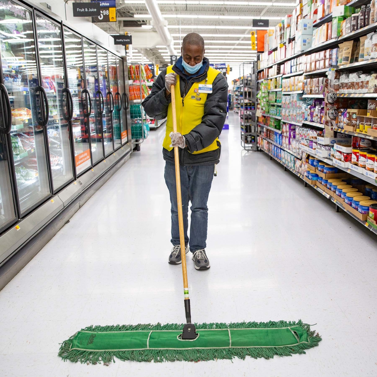 walmart associate sweeps store aisle